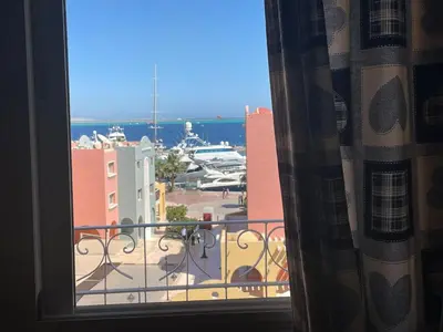 a view of a marina from a hotel room window at Hurghada's Marina view in Hurghada