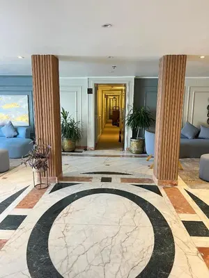 a lobby with two columns and a large rug at Luxor Aswan Coral 2 Nile Cruise every Saturday from Luxor 4 nights & every Wednesday from Aswan 3 nights in Luxor